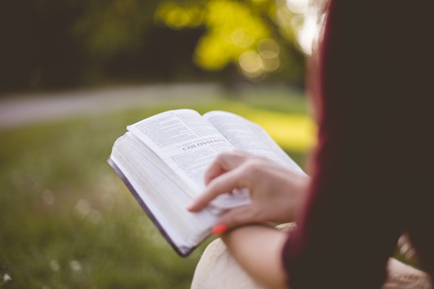 Student reading a book. 