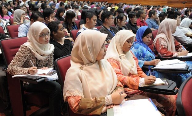 Students taking a lecture.