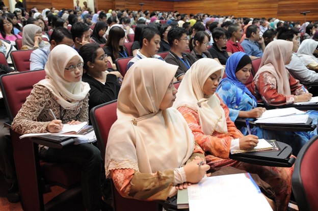 Students taking a lecture.